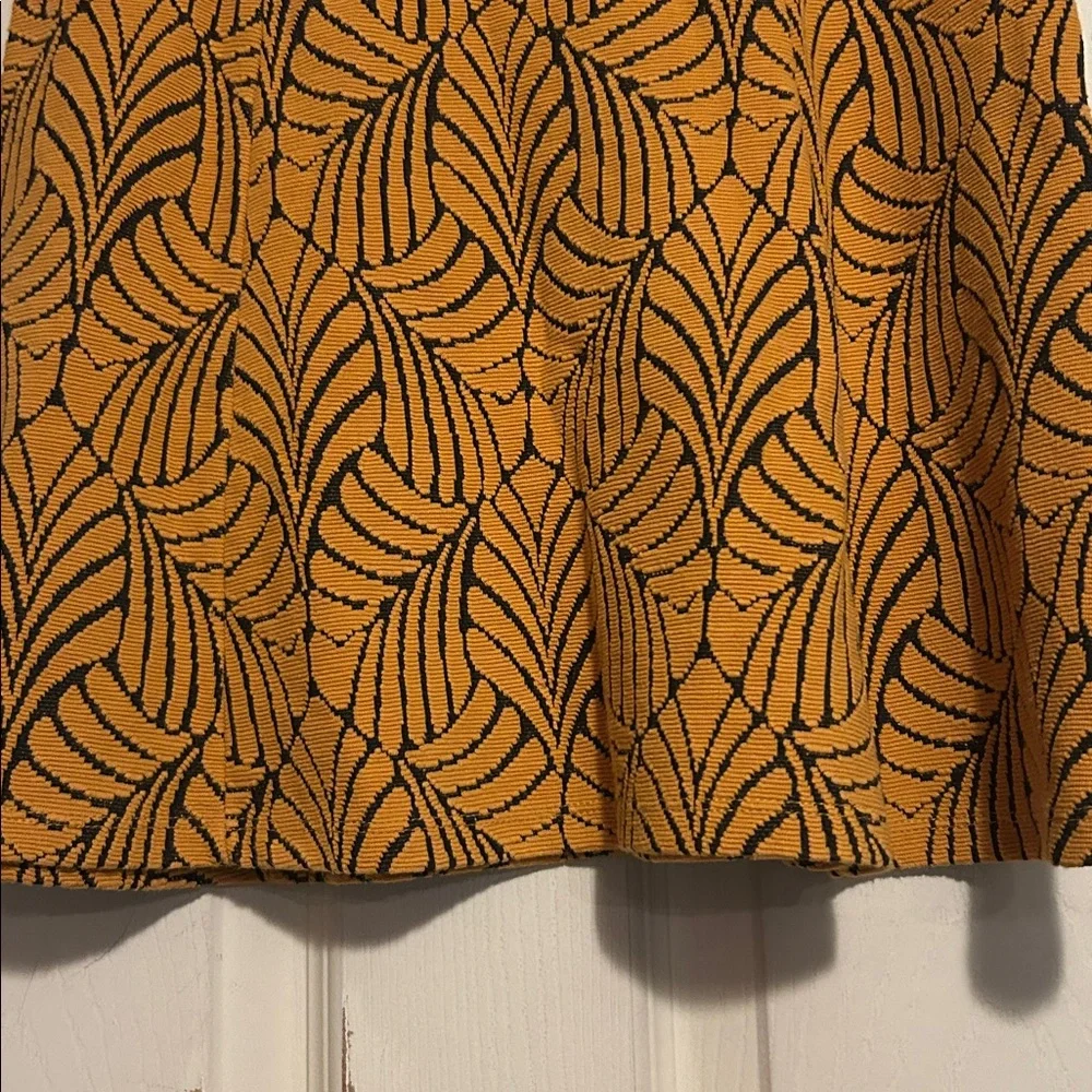 Stradivarius A-Line Mini Skirt Size Medium In Orange with Black Leaf Pattern